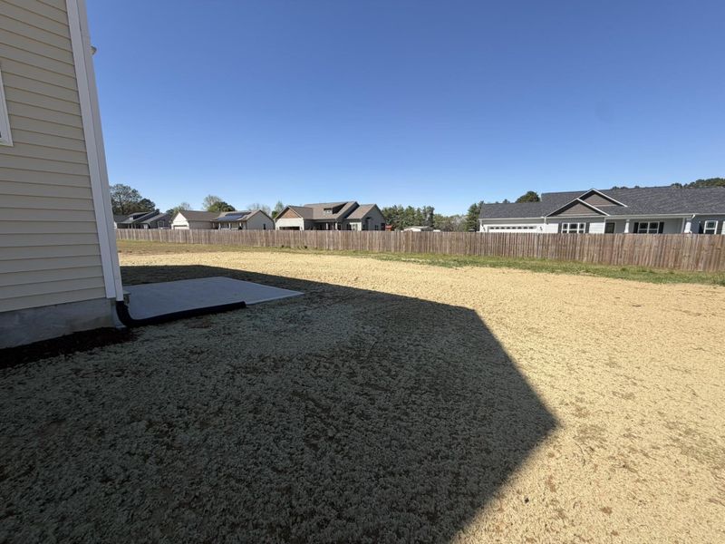 Exterior details and patio area of a home in Black Forest Pointe, Benson (Image 2).