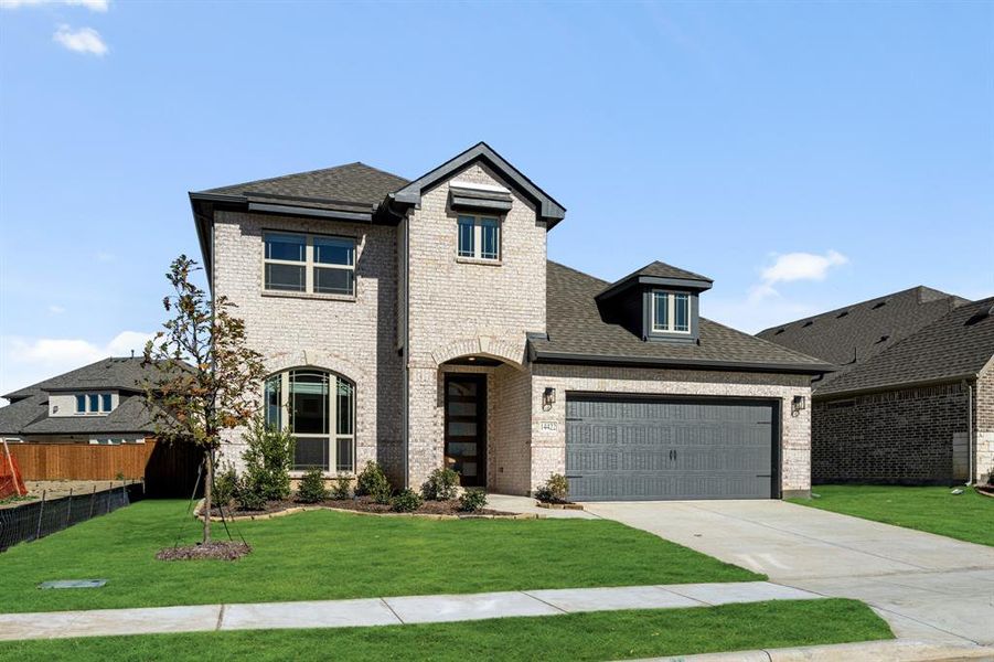 Front exterior of a new home in Creekview Meadows, Pilot Point, TX, highlighting curb appeal (Image 2).