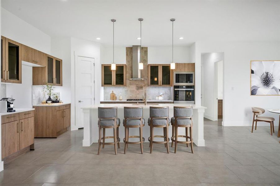 Kitchen featuring decorative backsplash, modern cabinets, wall chimney exhaust hood, and oven Kitchen featuring decorative backsplash, modern cabinets, wall chimney exhaust hood, and oven
