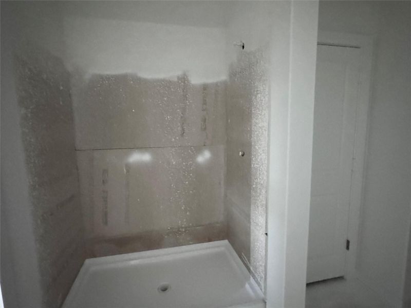 Full bathroom featuring a stall shower Full bathroom featuring a stall shower