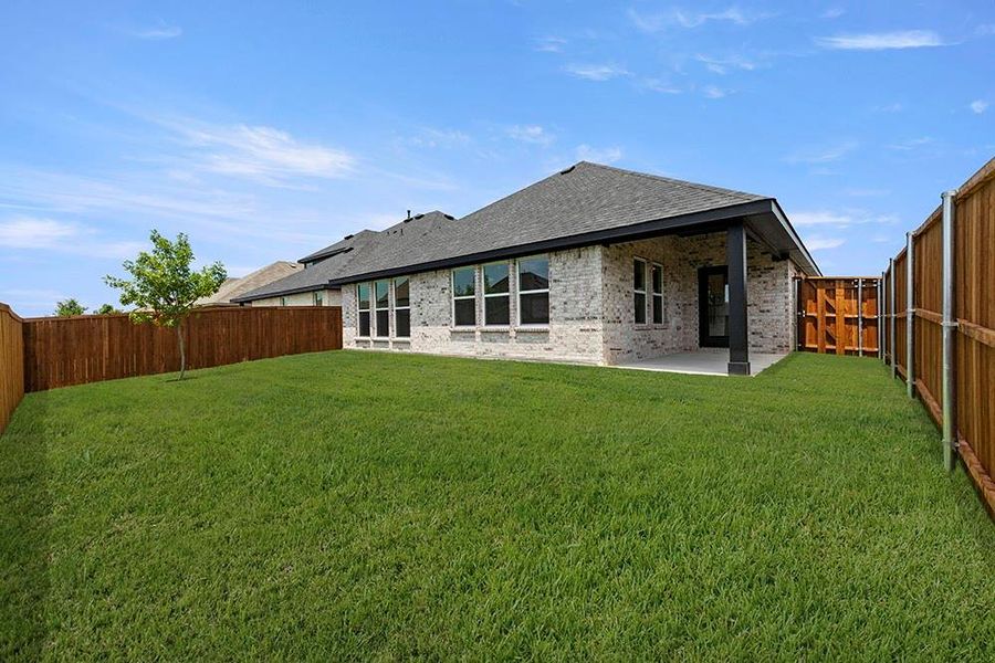Exterior details and patio area of a home in Walden Pond, Forney (Image 26).