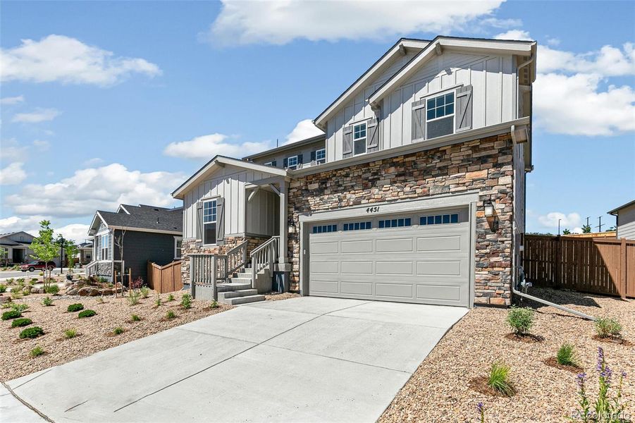 Front exterior of a new home in Terrain Oak Valley, Castle Rock, CO, highlighting curb appeal (Image 23).