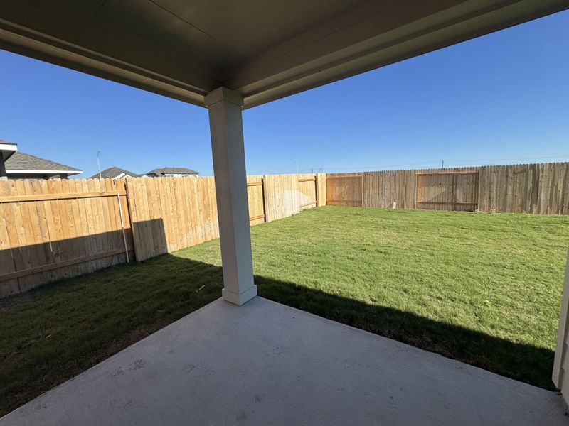 Exterior details and patio area of a home in Village at Three Oaks, Seguin (Image 3).
