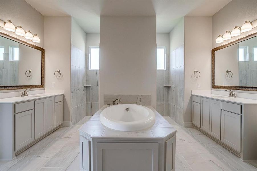 Bathroom featuring vanity and a healthy amount of sunlight