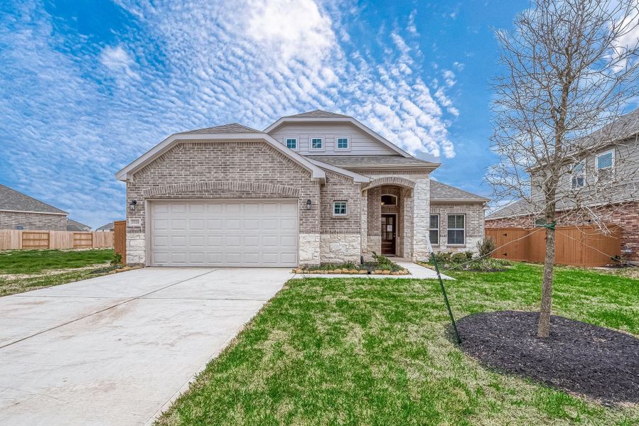 Representative exterior photo of a completed home built from the Floor Plan 1830 by Colina Homes in Grand Magnolia, Magnolia, TX (Image 1). Representative exterior photo of a completed home built from the Floor Plan 1830 by Colina Homes in Grand Magnolia, Magnolia, TX (Image 1).