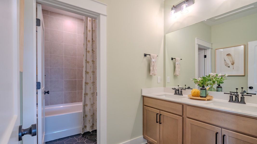 Spacious secondary bathroom with dual vanity and separate shower area Spacious secondary bathroom with dual vanity and separate shower area