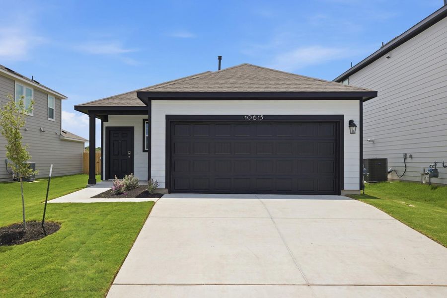 Front exterior of a new home in Stallion Run, Buda, TX, highlighting curb appeal (Image 24).