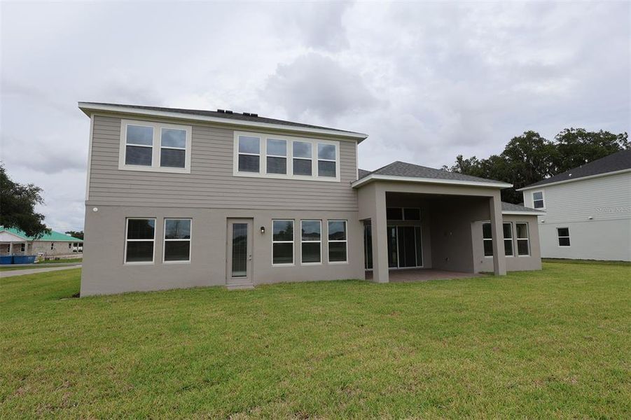Exterior details and patio area of a home in Solace at Corner Lake, Orlando (Image 18).