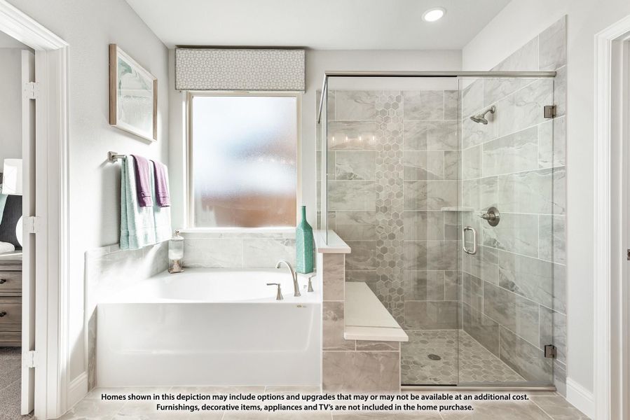 Ensuite bathroom with soaking tub, glass-enclosed walk-in shower, and gray tile walls