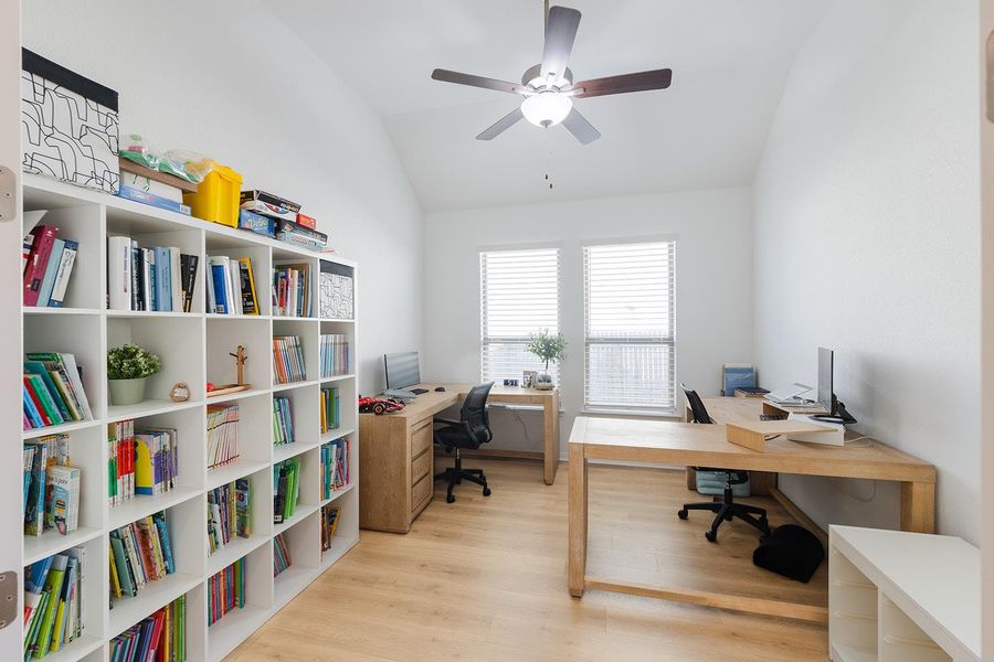 Office featuring light wood-style flooring, lofted ceiling, and ceiling fan