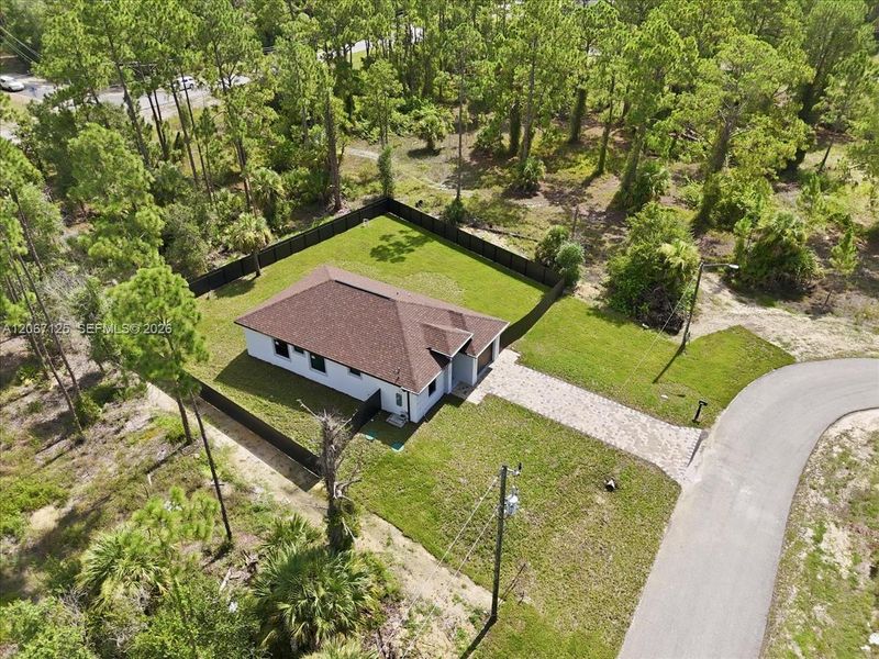 Front exterior of a new home in , Lehigh Acres, FL, highlighting curb appeal (Image 26).