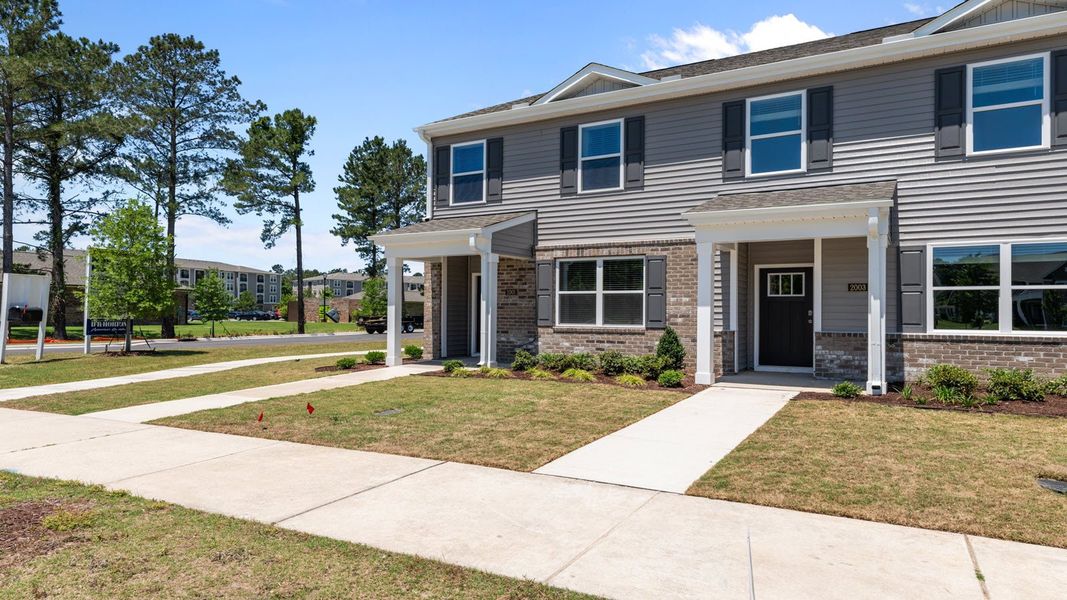Representative exterior photo of a completed home built from the PEARSON II by D.R. Horton in Clock Road Townhomes, New Bern, NC (Image 2). Representative exterior photo of a completed home built from the PEARSON II by D.R. Horton in Clock Road Townhomes, New Bern, NC (Image 2).