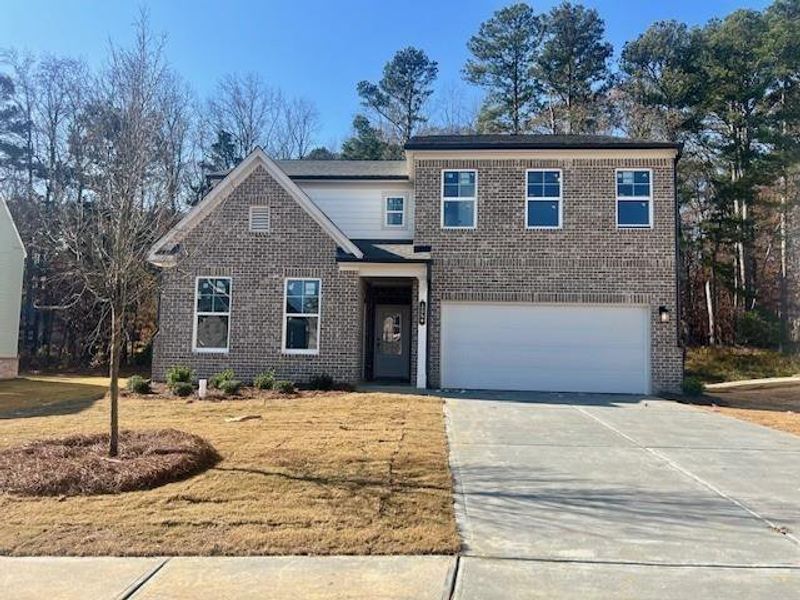 Front exterior of a new home in Riverside Ridge, Lawrenceville, GA, highlighting curb appeal (Image 1).