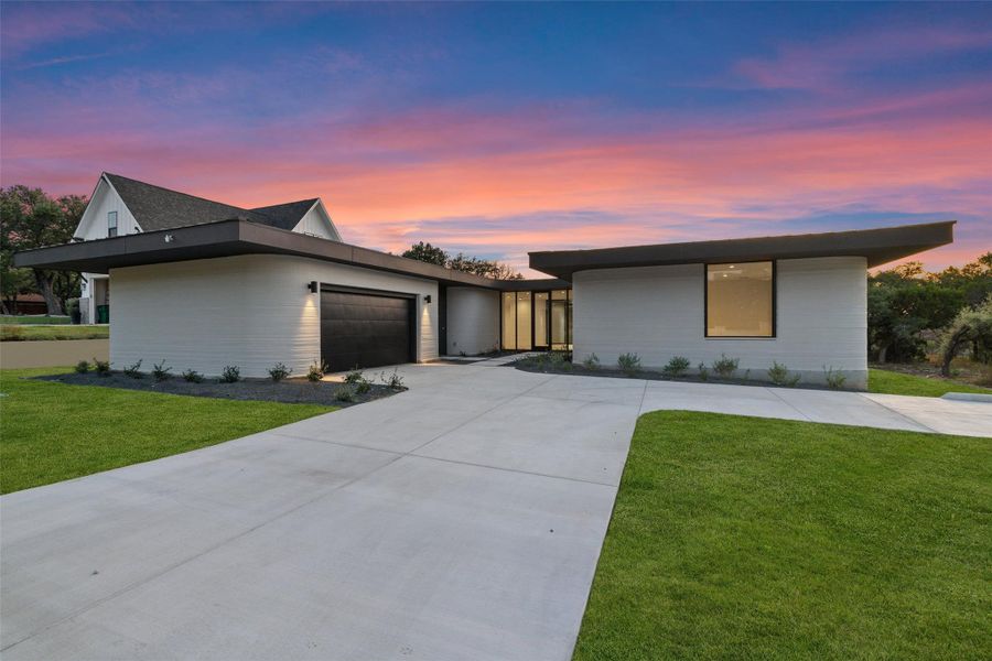 Front exterior of a new home in Wimberley Springs, Wimberley, TX, highlighting curb appeal (Image 1).