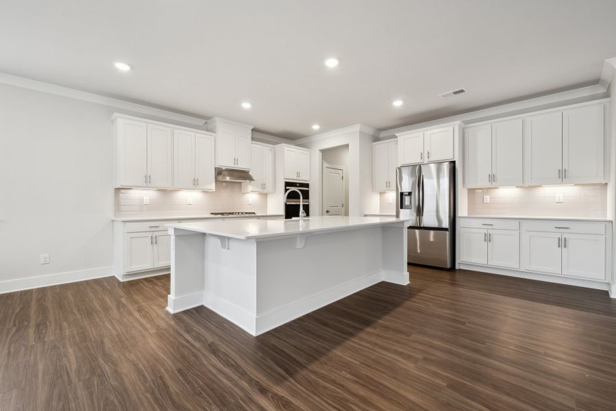 A kitchen with white cabinets. A kitchen with white cabinets.