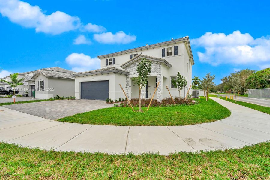 Front exterior of a new home in , Miami, FL, highlighting curb appeal (Image 25). Front exterior of a new home in , Miami, FL, highlighting curb appeal (Image 25).