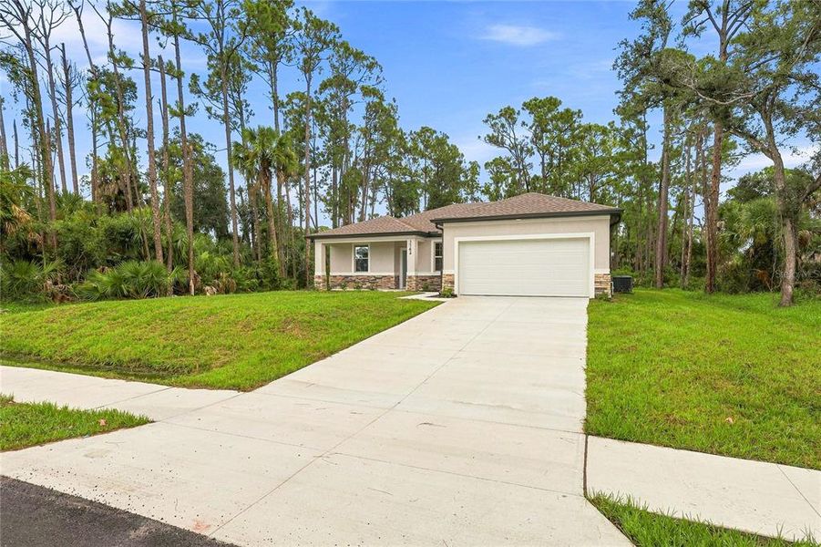 Front exterior of a new home in , North Port, FL, highlighting curb appeal (Image 19).