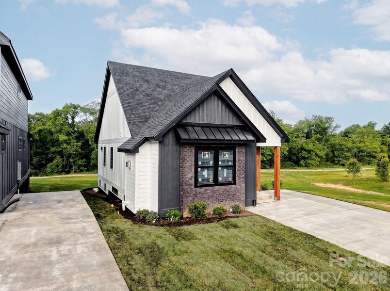 Front exterior of a new home in , Hendersonville, NC, highlighting curb appeal (Image 2). Front exterior of a new home in , Hendersonville, NC, highlighting curb appeal (Image 2).