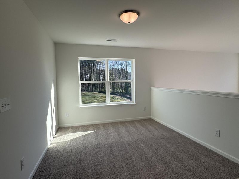 Spacious, unfurnished interior of a new home in East Main Townes, Spartanburg (Image 19).
