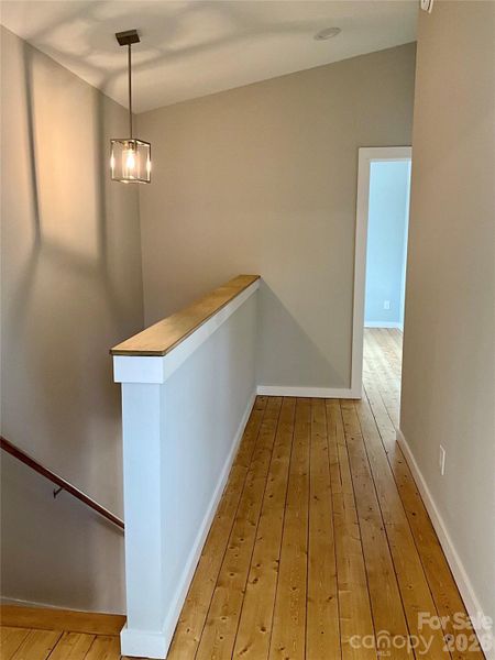 Well lit stair well, Hardwoods throughout upstairs