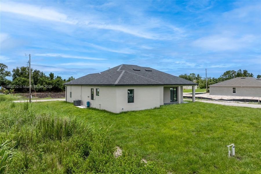 Front exterior of a new home in , Lehigh Acres, FL, highlighting curb appeal (Image 16). Front exterior of a new home in , Lehigh Acres, FL, highlighting curb appeal (Image 16).