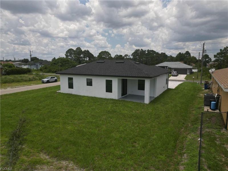 Front exterior of a new home in , Lehigh Acres, FL, highlighting curb appeal (Image 13).