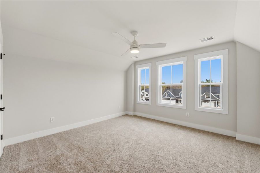 This airy room features bright windows and plush c