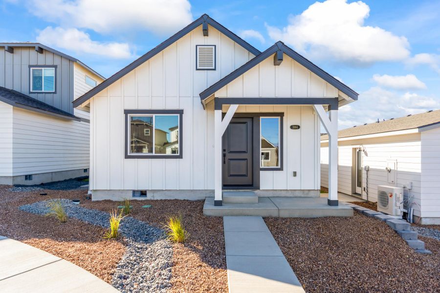 Front exterior of a new home in Feather Ridge, Redmond, OR, highlighting curb appeal (Image 22).
