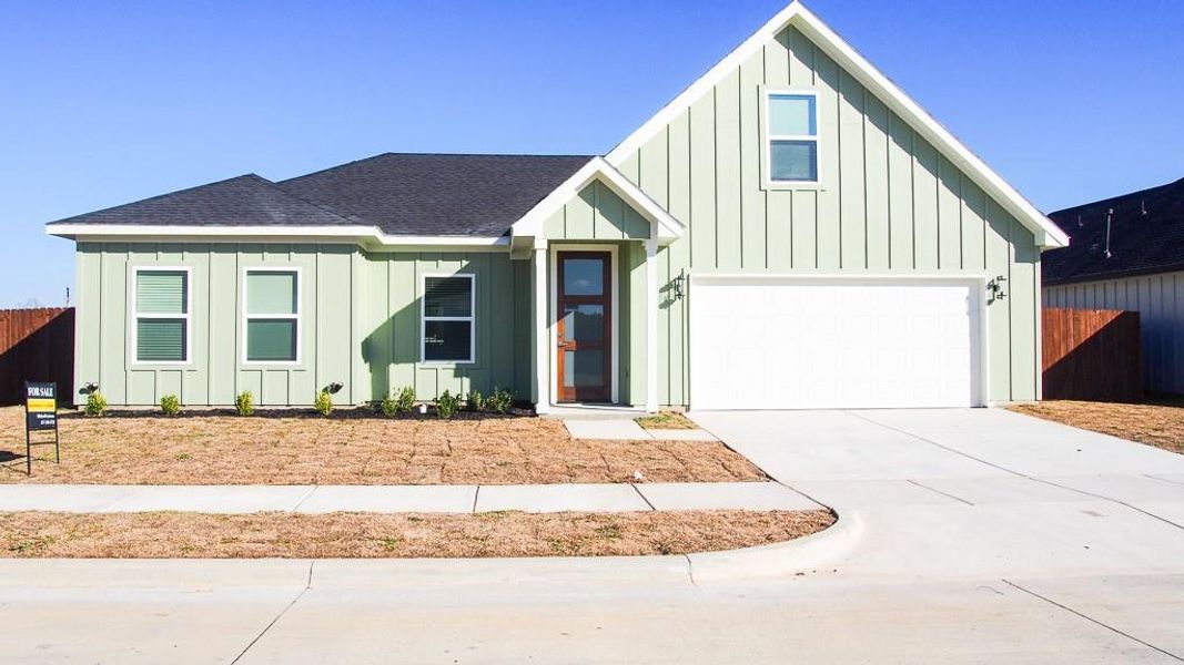 Front exterior of a new home in , Godley, TX, highlighting curb appeal (Image 1). Front exterior of a new home in , Godley, TX, highlighting curb appeal (Image 1).
