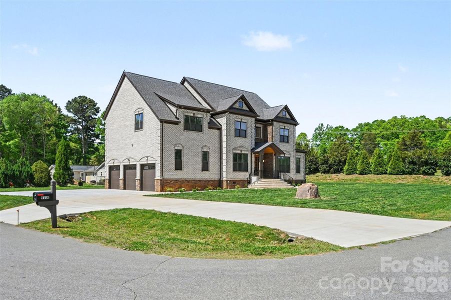 Front exterior of a new home in , Concord, NC, highlighting curb appeal (Image 26).