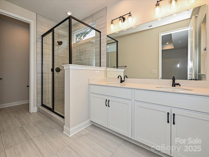 Designer Primary Bath with Dual Vanity and Walk-In Shower.