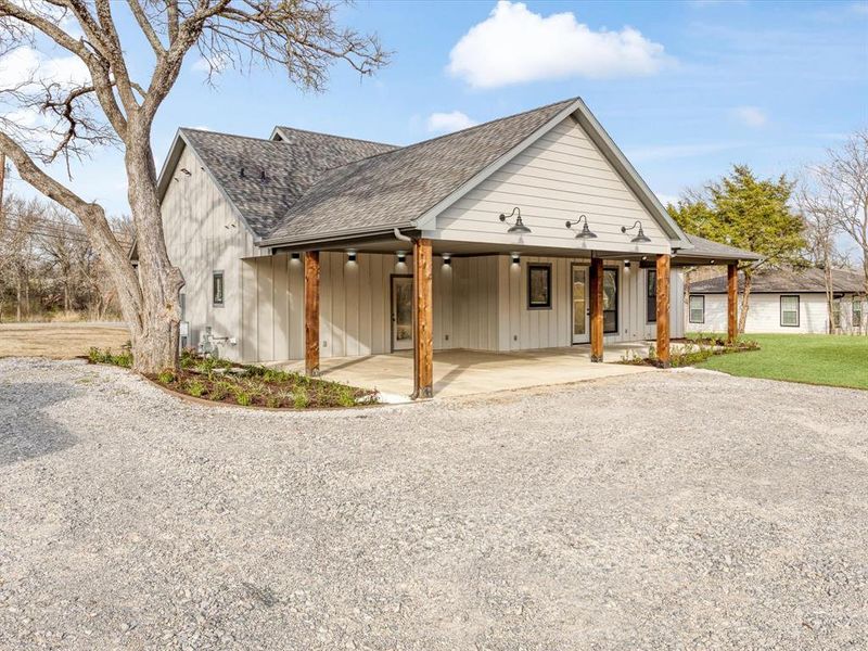 View of 2 car carport and large back porch area
