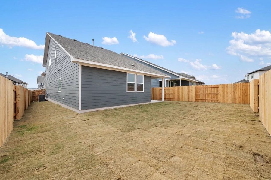 Exterior details and patio area of a home in Lariat, Liberty Hill (Image 27).