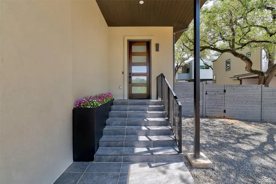 Doorway to property featuring stucco siding