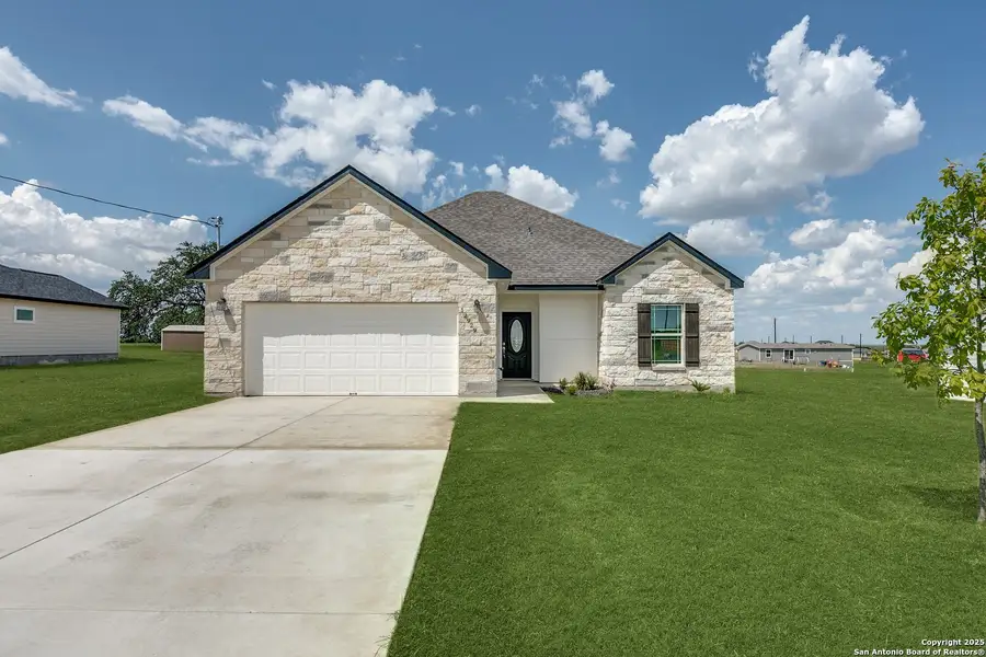 Front exterior of a new home in , Atascosa, TX, highlighting curb appeal (Image 2).