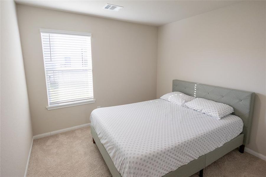 Three additional bedrooms, each well-proportioned with good natural light and closet space. Perfect for family, guests, or home office needs.