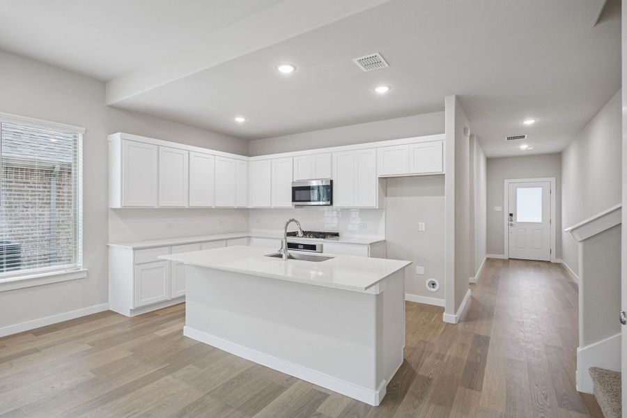Kitchen in the Stanley II home plan by Trophy Signature Homes – REPRESENTATIVE PHOTO Kitchen in the Stanley II home plan by Trophy Signature Homes – REPRESENTATIVE PHOTO
