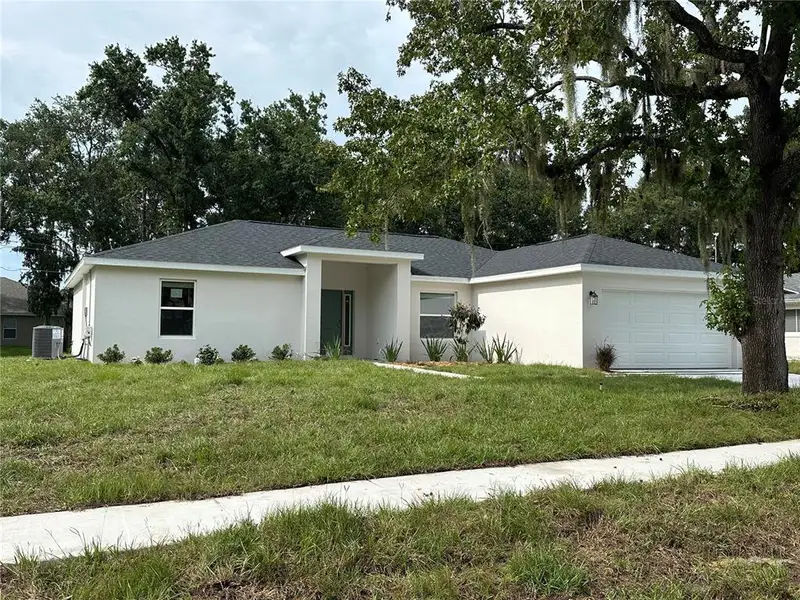 Front exterior of a new home in , Lakeland, FL, highlighting curb appeal (Image 1). Front exterior of a new home in , Lakeland, FL, highlighting curb appeal (Image 1).
