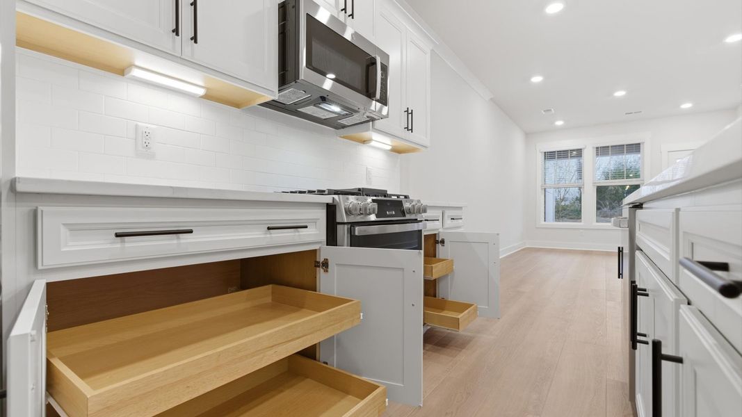 First-rate kitchen with abundant storage and superior cabinetry in a thoughtfully designed space