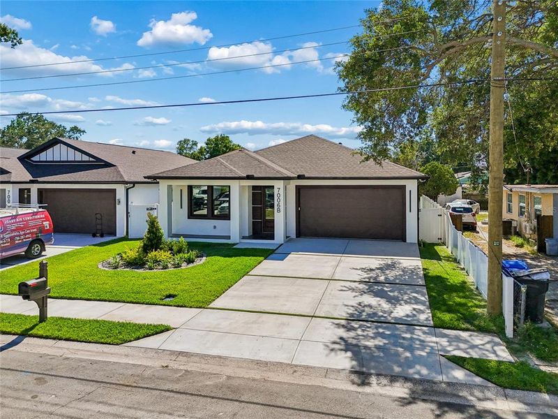 Front exterior of a new home in , Tampa, FL, highlighting curb appeal (Image 33).