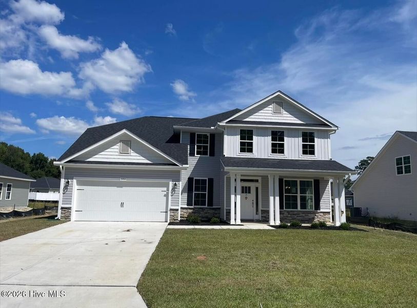Front exterior of a new home in Summer Place, Grimesland, NC, highlighting curb appeal (Image 1). Front exterior of a new home in Summer Place, Grimesland, NC, highlighting curb appeal (Image 1).