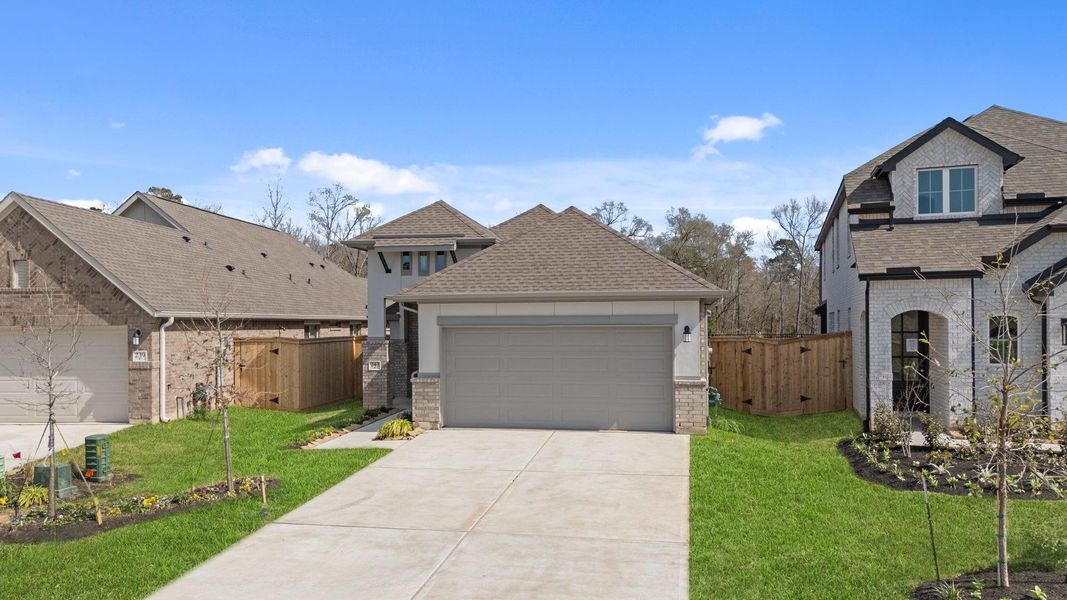 Front exterior of a new home in Grand Central Park, Conroe, TX, highlighting curb appeal (Image 19). Front exterior of a new home in Grand Central Park, Conroe, TX, highlighting curb appeal (Image 19).
