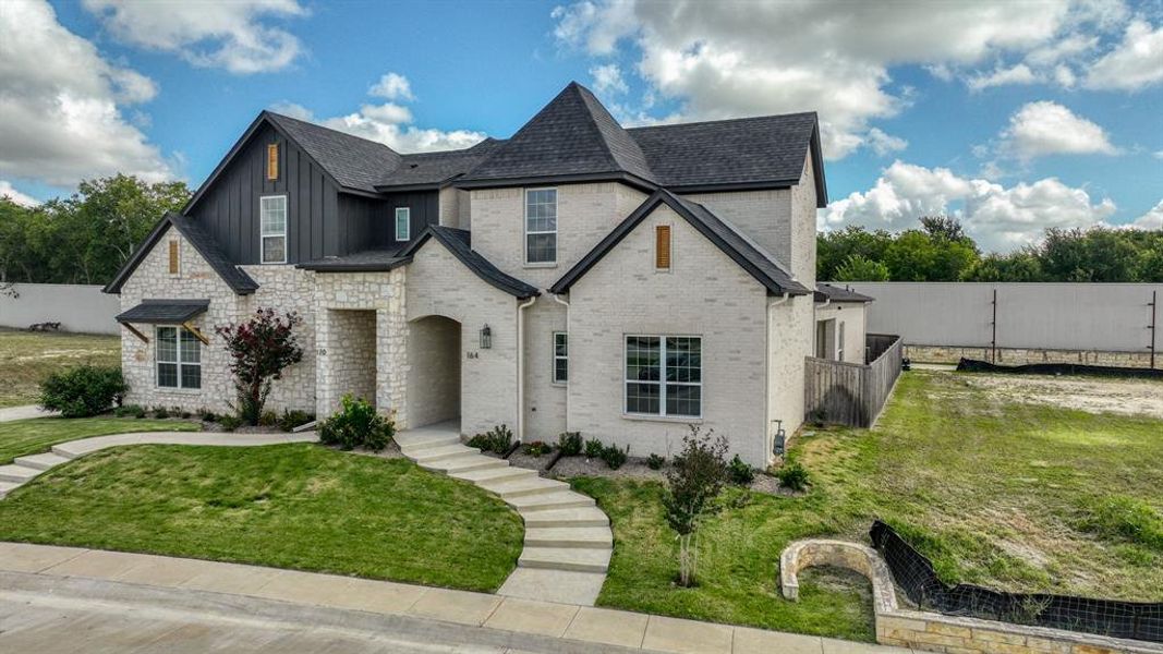 Front exterior of a new home in , Aledo, TX, highlighting curb appeal (Image 2).