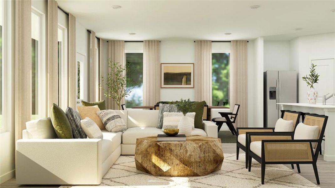 Sitting room featuring a healthy amount of sunlight and light wood-type flooring