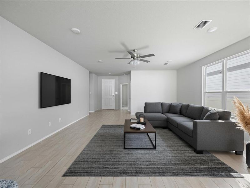 Virtually Staged-Living area with light wood-style floors, ceiling fan, and recessed lighting Virtually Staged-Living area with light wood-style floors, ceiling fan, and recessed lighting
