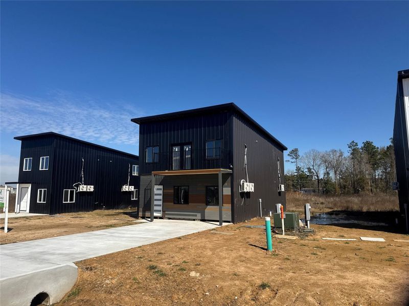 Front exterior of a new home in , Cleveland, TX, highlighting curb appeal (Image 2). Front exterior of a new home in , Cleveland, TX, highlighting curb appeal (Image 2).