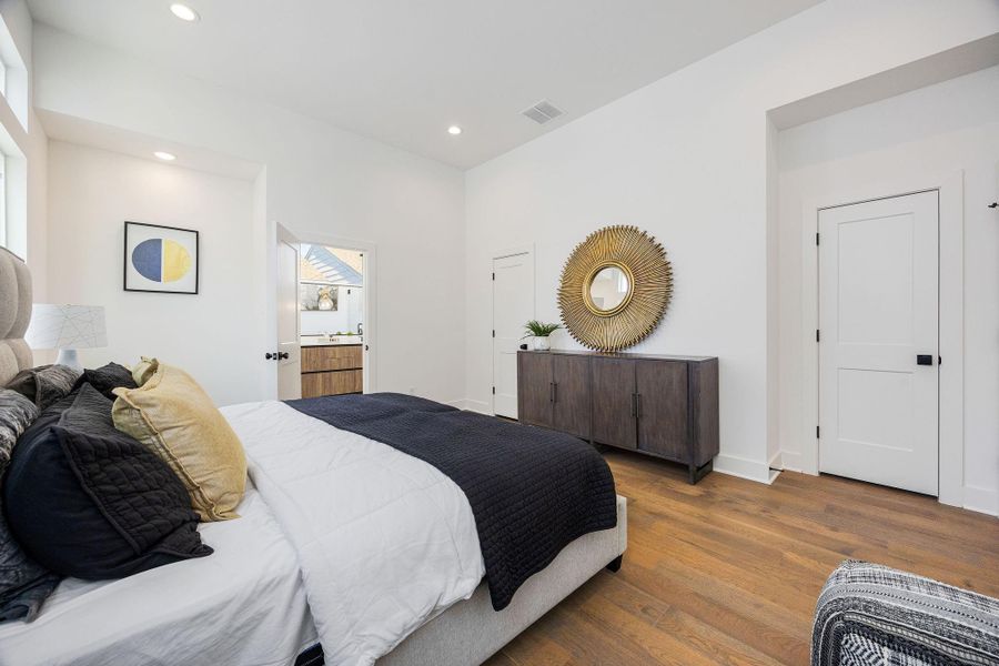 Primary bedroom with large walk-in closet and full bathroom attached.