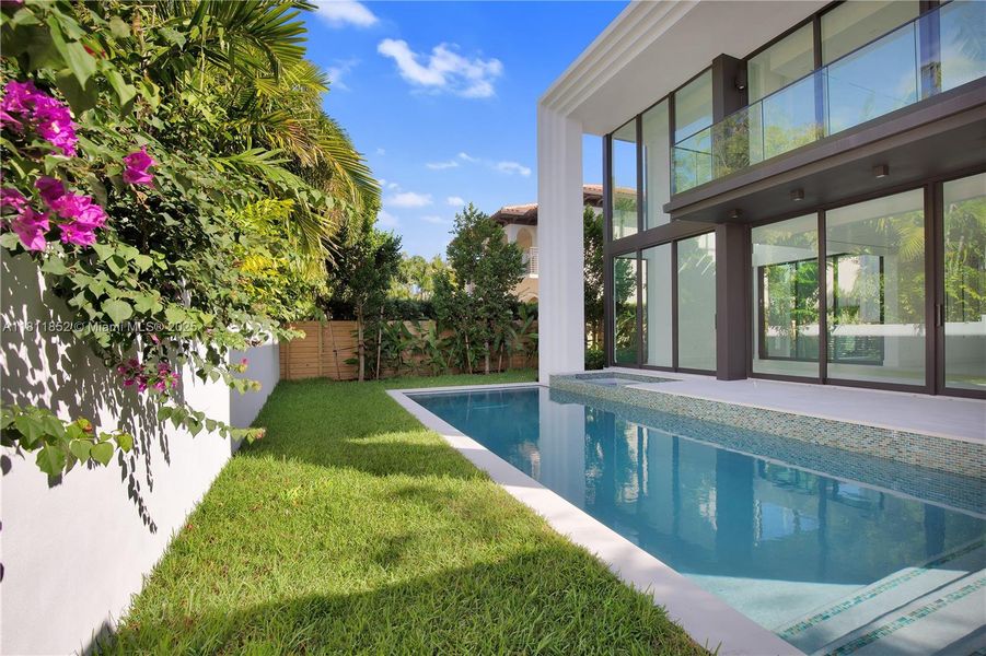 Front exterior of a new home in , Miami Beach, FL, highlighting curb appeal (Image 1). Front exterior of a new home in , Miami Beach, FL, highlighting curb appeal (Image 1).