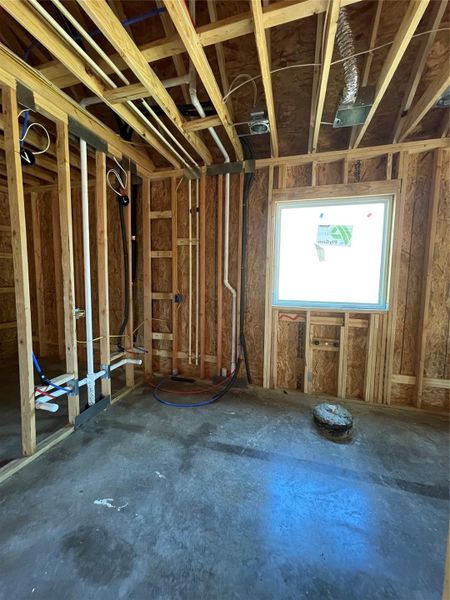 His & Her Dual vanity sinks to the left accompanied by a linen closet to the left of the Vanity. A freestanding tub will be placed under the picture window to allow in the natural lighting.