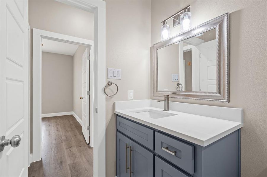 Bathroom with vanity and light wood-style floors Bathroom with vanity and light wood-style floors